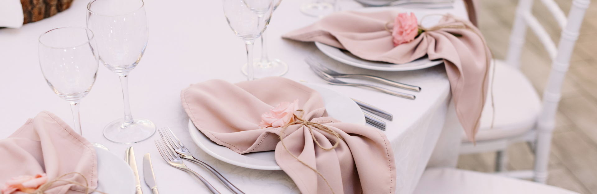 Pink linens on tableware at wedding reception